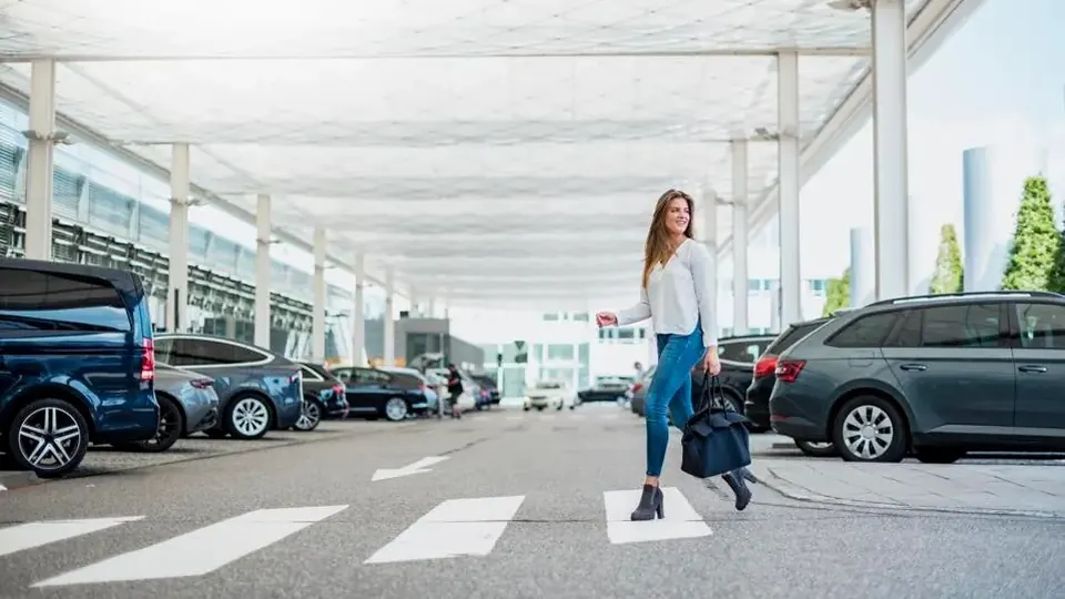 Traveler arriving for an airport parking transfer